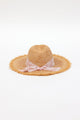 back of braided raffia sunhat with pale pink floral trim