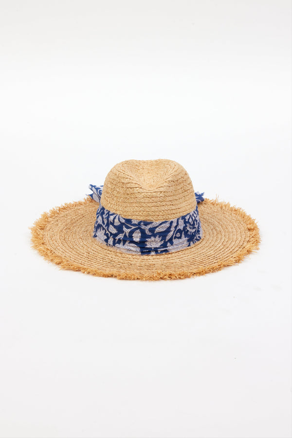 front of braided raffia sunhat with royal blue floral trim