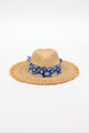front of braided raffia sunhat with royal blue floral trim