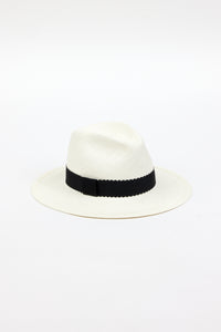 3/4 angle of white straw panama hat with black ribbon trim