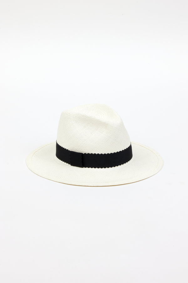 3/4 angle of white straw panama hat with black ribbon trim