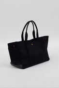 3/4 angle of black tote with pockets