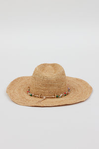 Back of tan straw woven sunhat with multi colored beaded trim