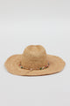 Back of tan straw woven sunhat with multi colored beaded trim