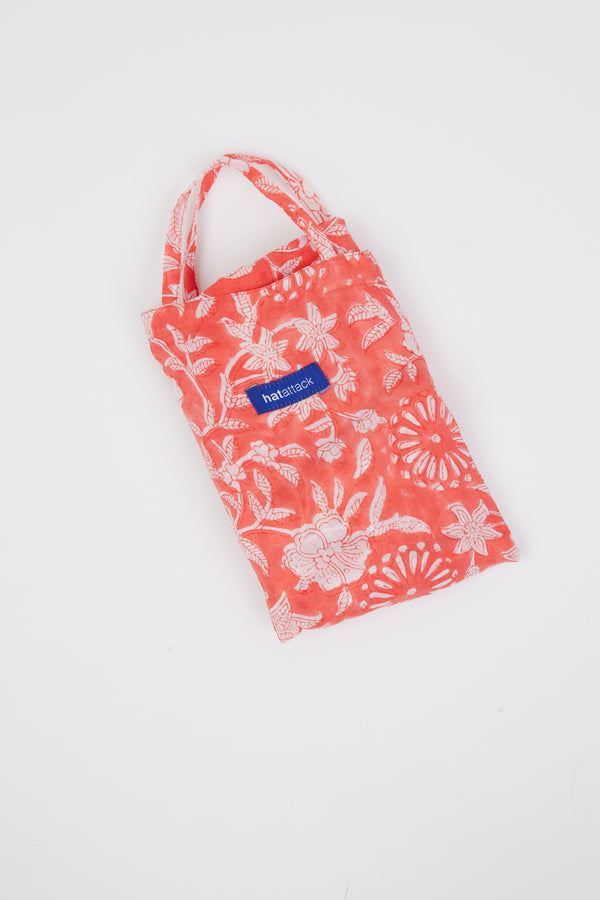 coral and white floral sarong bag