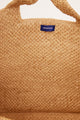 Inside of natural woven structured tote with handles