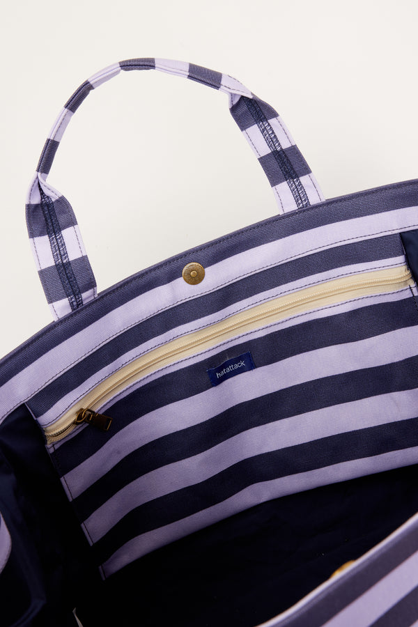 inside of blue and lavender striped bag