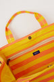 inside of coral and yellow striped bag