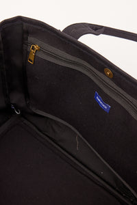 Inside of black tote with pockets