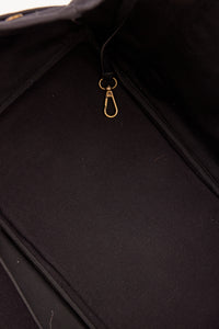 Interior of black tote with pockets