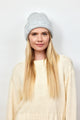 Model wearing light grey cuff beanie