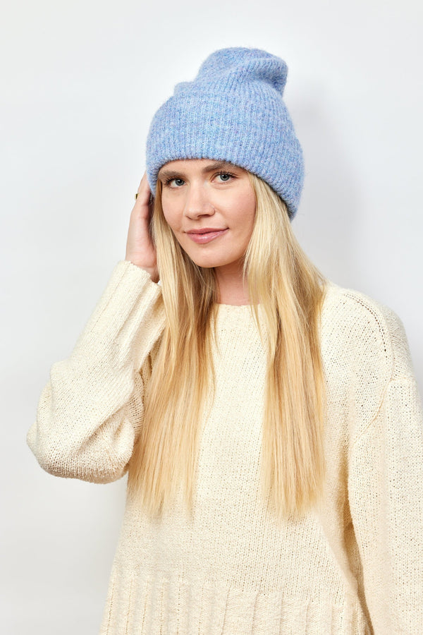 Model wearing light blue cuff beanie