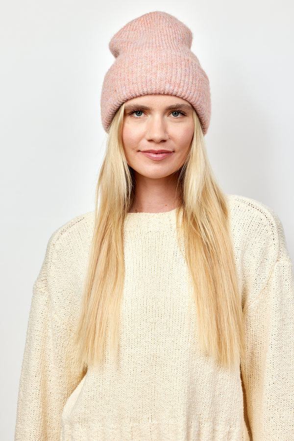 Light pink cuff beanie on model