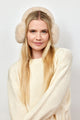 Model wearing natural colored faux fur earmuffs and looking at camera