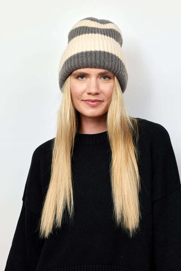 Grey and ivory striped ribbed knit cuffed beanie on model