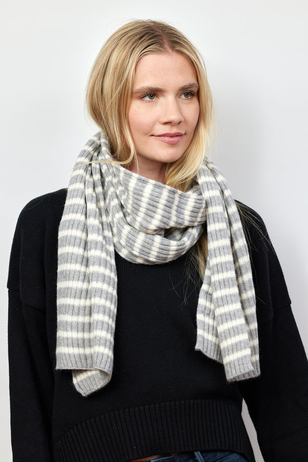 Grey and ivory ribbed striped scarf on model looking to her left