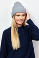 Light grey cashmere rib beanie on model wearing grey beanie