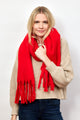 Model wearing red solid scarf with fringe