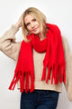 Model holding her arm up while wearing red solid scarf with fringe 