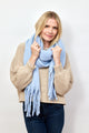 Light blue solid scarf with fringe on model wearing tan scarf