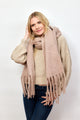 Model wearing taupe solid scarf with fringe