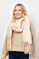 Blush pink solid scarf with fringe on smiling model