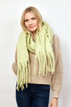 Mint green solid scarf with fringe on model