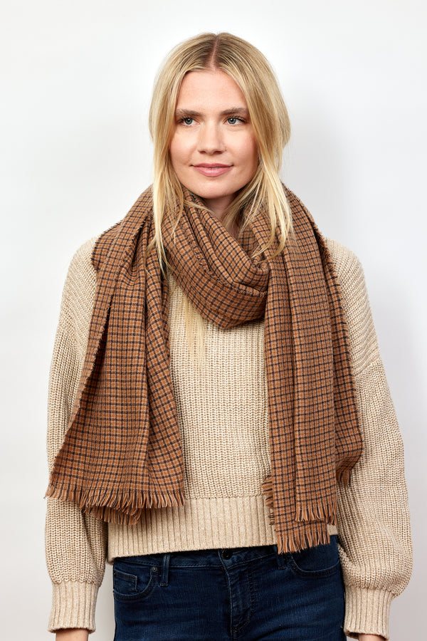 Brown and tan geometric check scarf on model in tan sweater