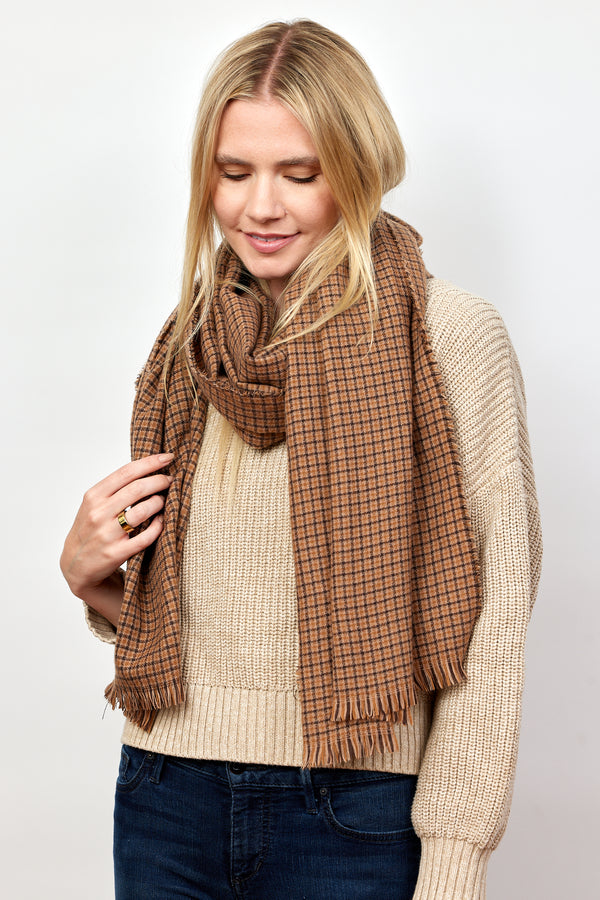 Brown and tan geometric check scarf on model