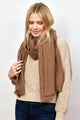 Brown and tan geometric check scarf on model