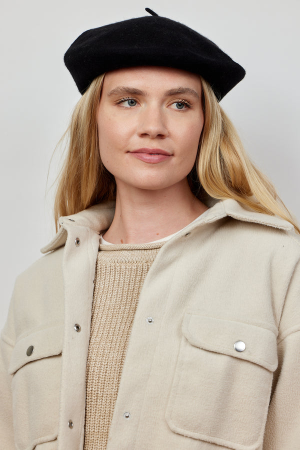 Model wearing black wool felt beret