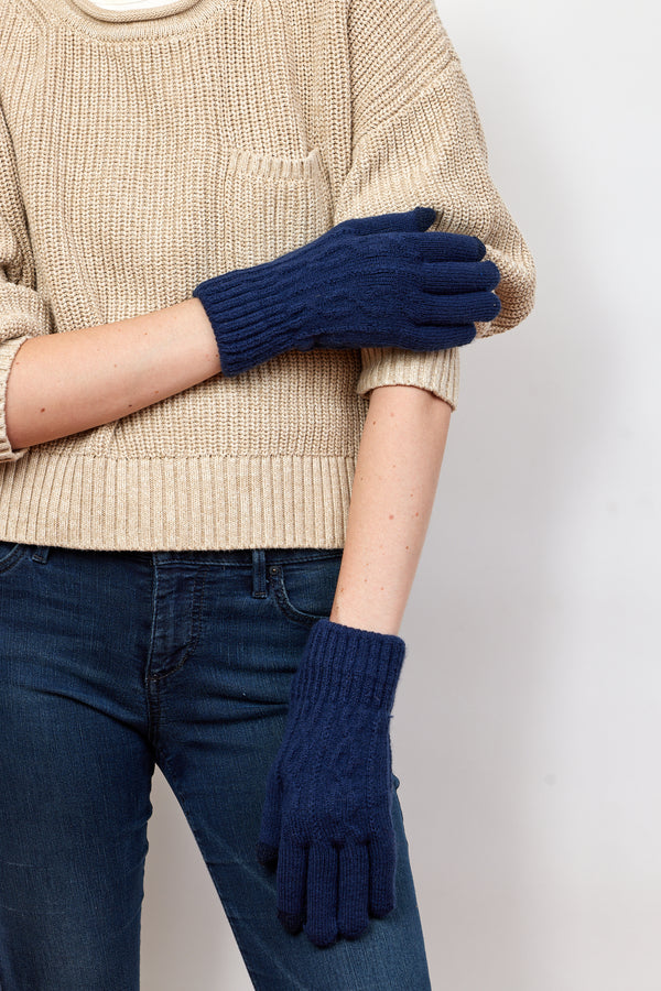 Model wearing navy knit touch screen gloves