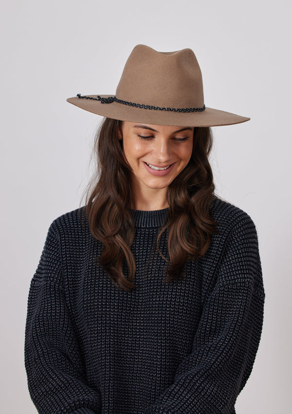 Taupe brown wool felt brimmed hat on model in charcoal sweater
