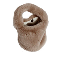 Taupe faux fur handbag on a white background