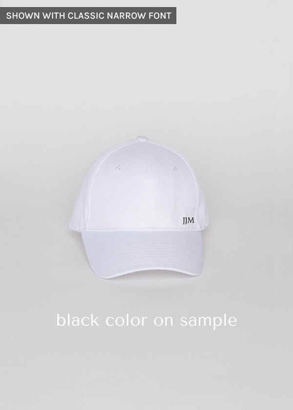 White baseball hat with black embroidered letters