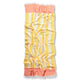 Colorful striped towel with coral and yellow pattern on a white background
