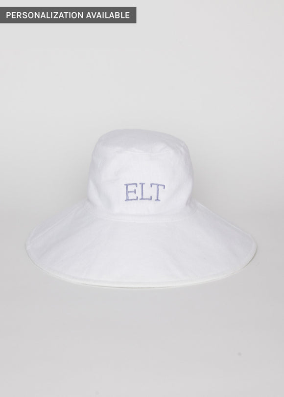 White packable sun hat with lavender embroidered letters