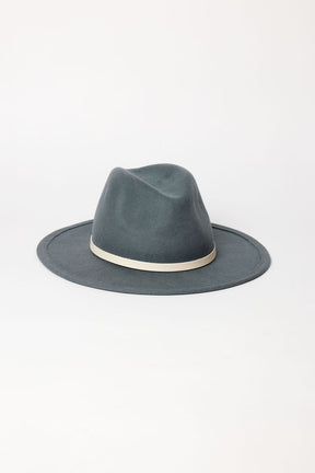 Blue fedora hat with a white band on a light gray background