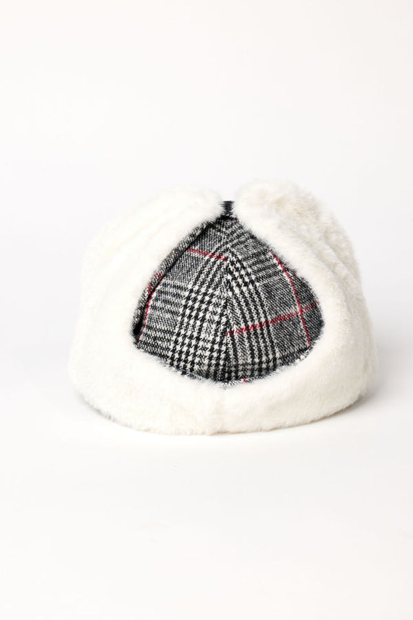 Back of black plaid cap with earflaps