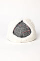 Back of black plaid cap with earflaps