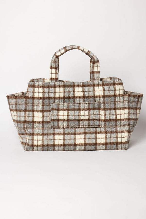 Brown and grey plaid tote bag with suitcase strap on a white background
