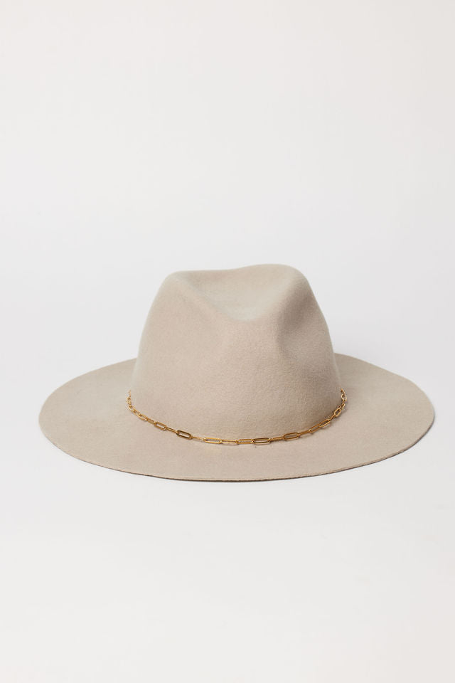 Beige hat with a gold chain on a white background