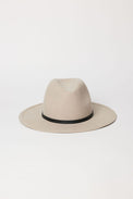 Beige fedora hat with a black band on a white background