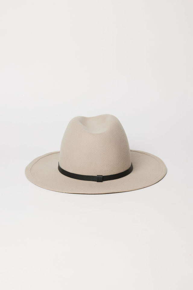Beige fedora hat with a black band on a white background