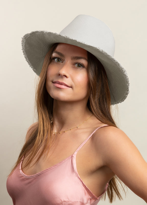 Model wearing grey sun hat with fringed brim