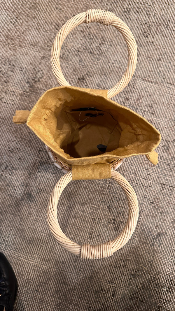 Top view of opening of small straw bag