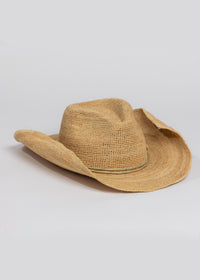 3/4 angle of raffia straw cowboy hat with metallic gold wrap detail