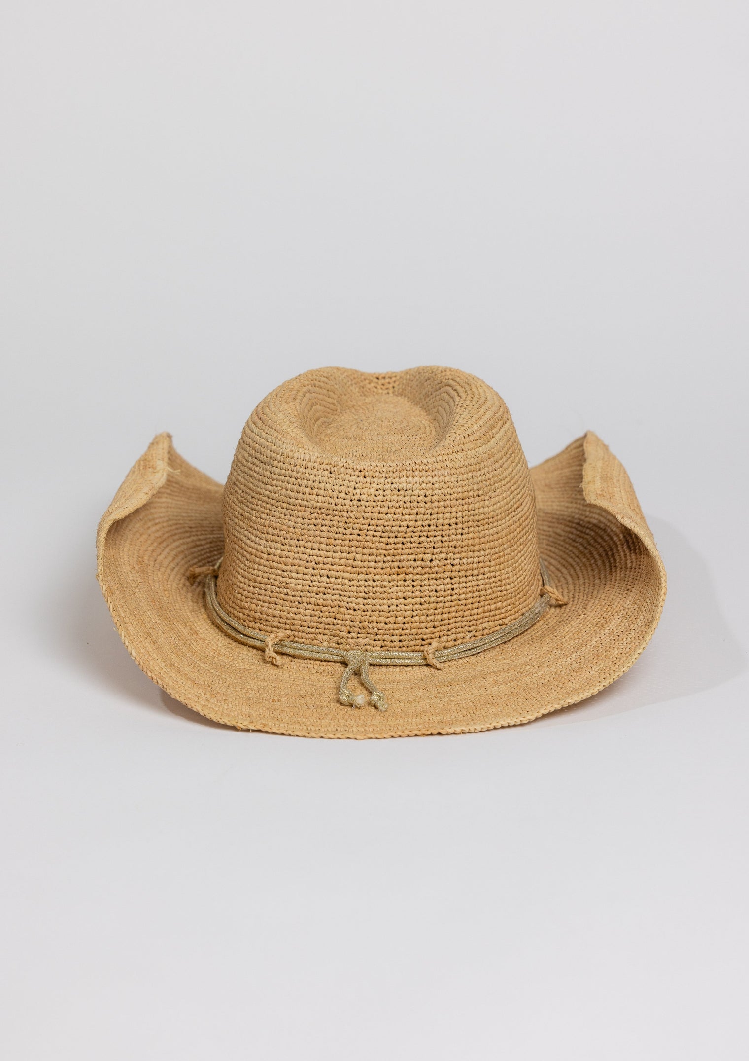Back of raffia straw cowboy hat with metallic gold wrap detail