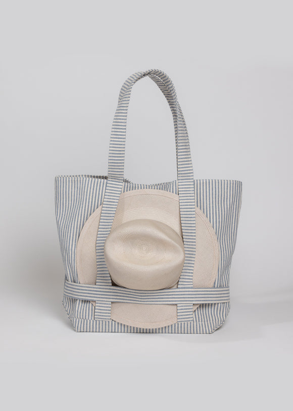 Blue and white striped canvas tote and sun hat attached