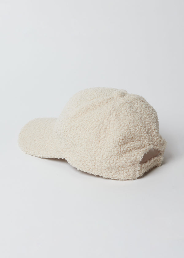 Back of ivory sherpa baseball cap